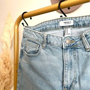 Forever 21 jeans light wash jeans distressed on both sides of the pant legs -